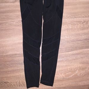 Long black leggings with mesh cutouts